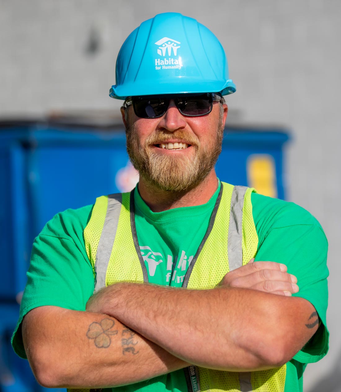 Habitat home builder smiling