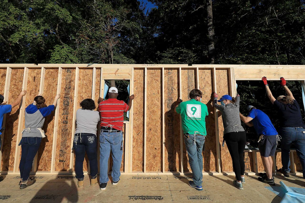 Volunteers help at a Habitat for Humanity home