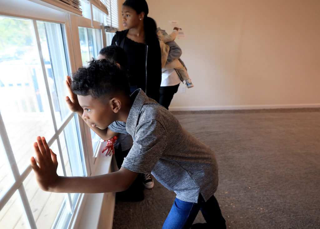 Scott family children explore their new Habitat for Humanity Peninsula and Greater Williamsburg home