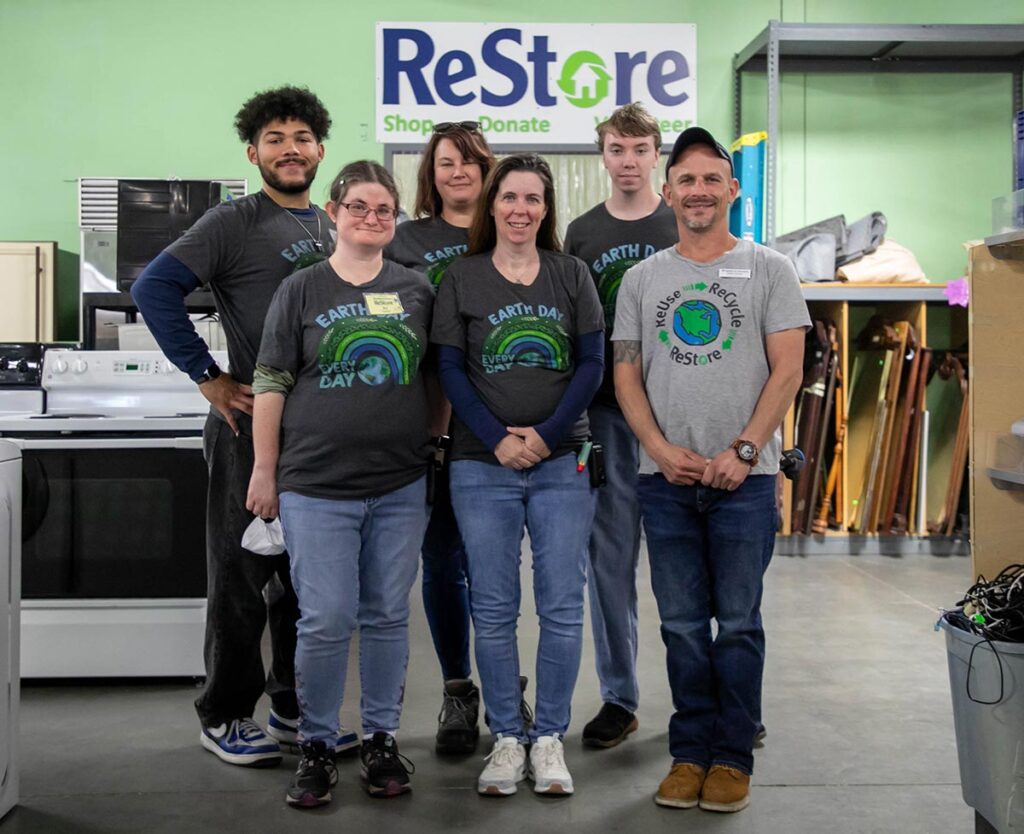 Newport News ReStore people wearing Earth Day shirts. April 11, 2023