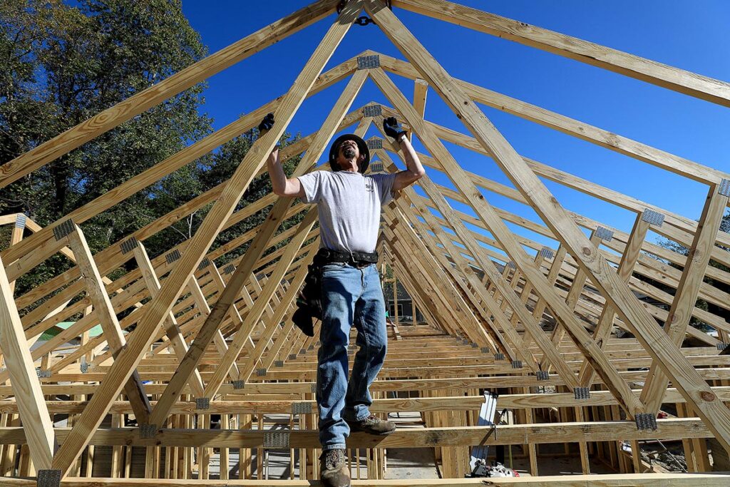 Roof trusses are installed on the Habitat for Humanity 3D Printed house in Williamsburg Wednesday October 20, 2021.