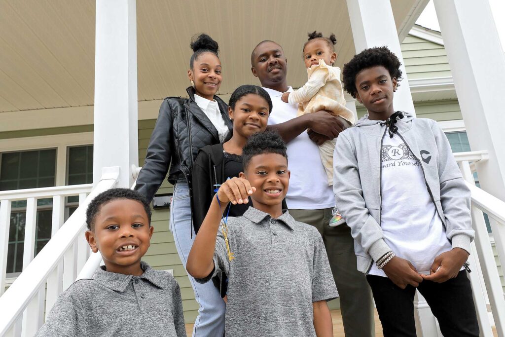 Jeffery and Tonya Scott along with their five children cut the ribbon on their new Habitat for Humanity home in Hampton Saturday October 1, 2022.