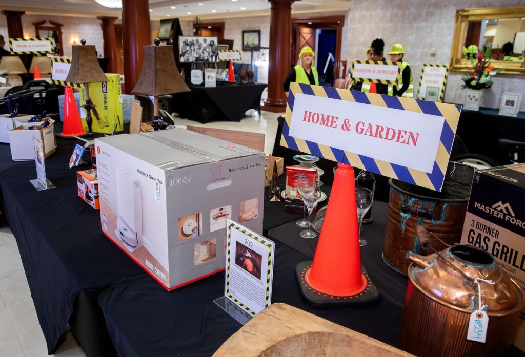 Auction items at Raise the Roof 2026.