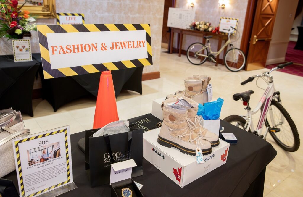 Auction items at Raise the Roof 2026.