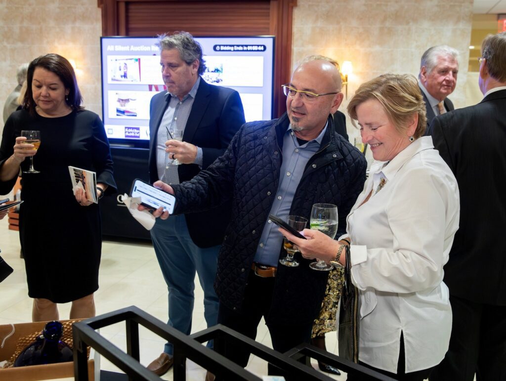 People bidding on auction items. 