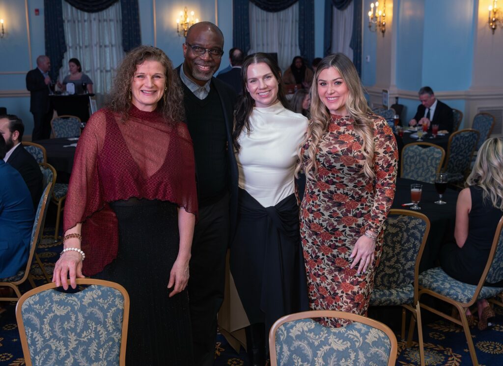 People smiling and posing for the camera.