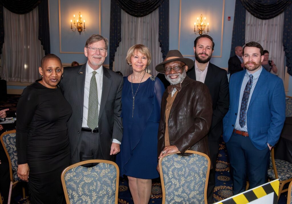 People smiling and posing for the camera.