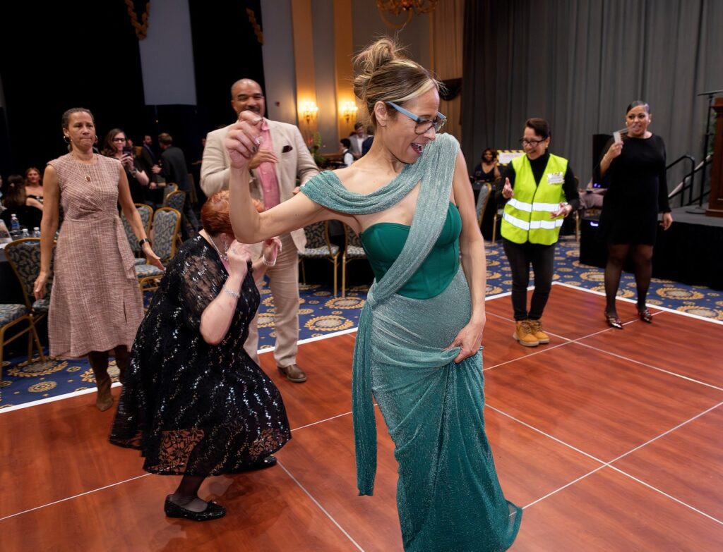 Women in dress dancing. 