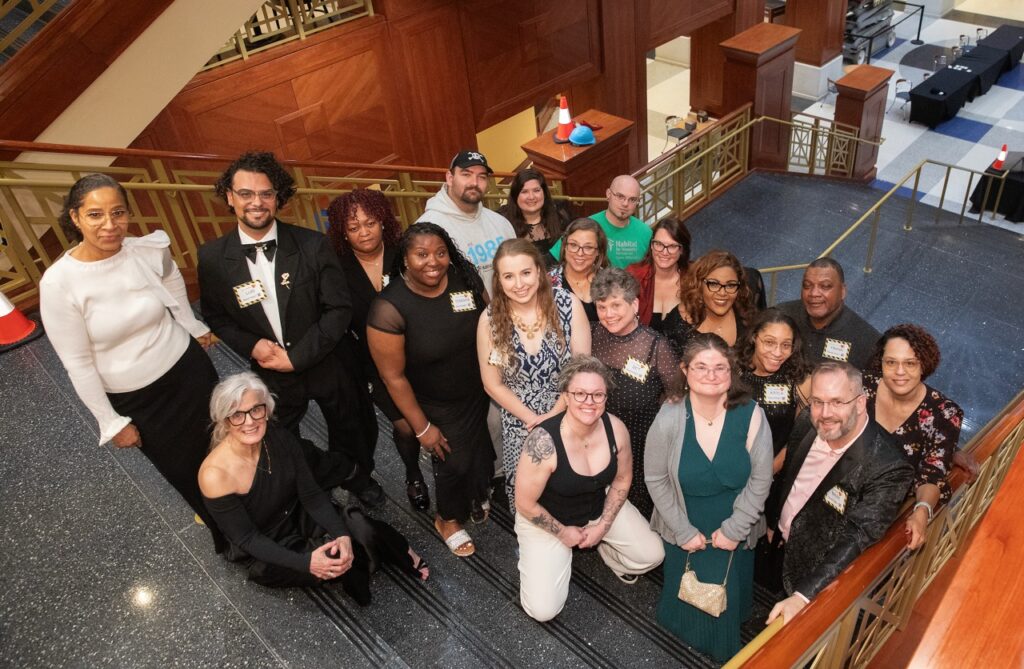 Habitat for Humanity Peninsula and Greater Williamsburg team posing on the steps. 