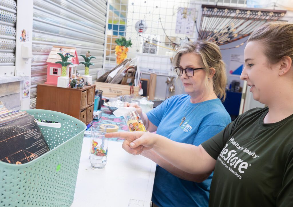 Two women working in the Habitat eStore ReStore