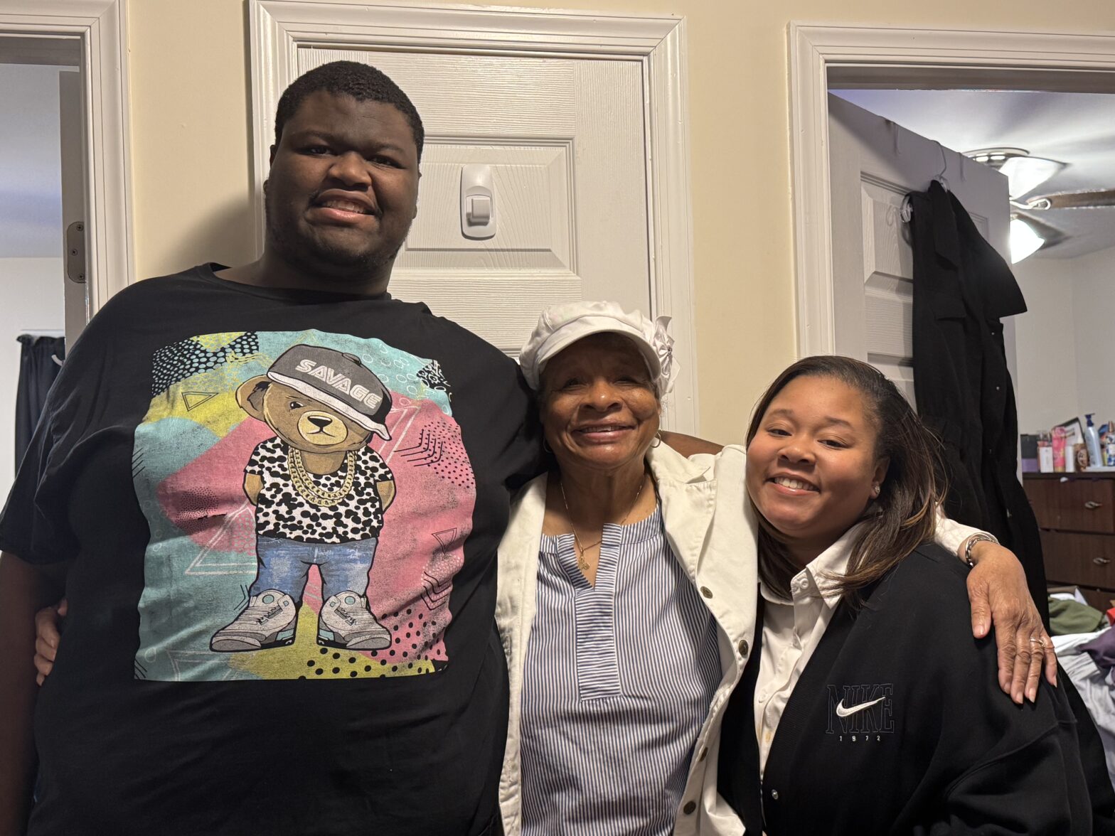 Three people smiling in a group