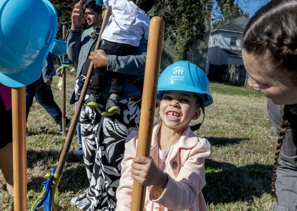 Little girl holding shovel at Habitat for Humanity Ground Breaking
