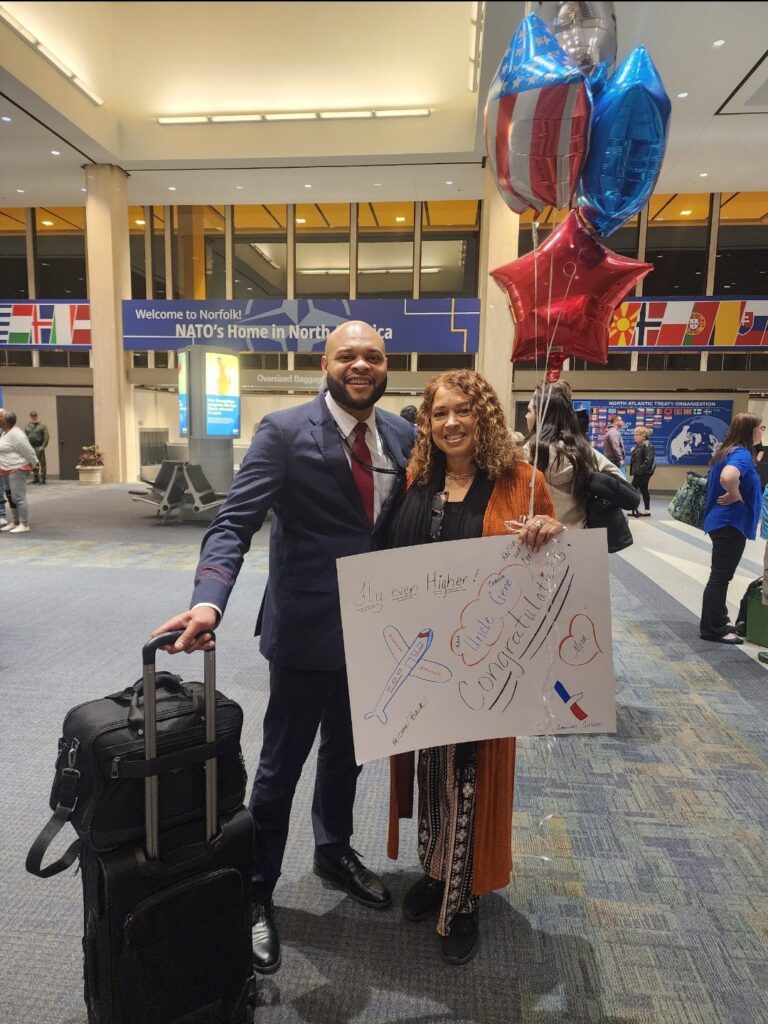 Woman standing with her son at the airport 